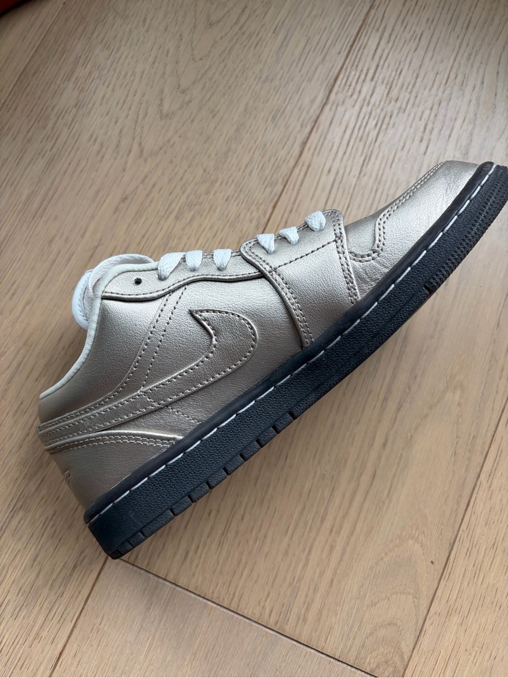 Jordan Women’s Metallic Gold and White Low-Top Sneakers